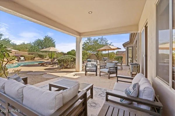 a view of a backyard with sitting area