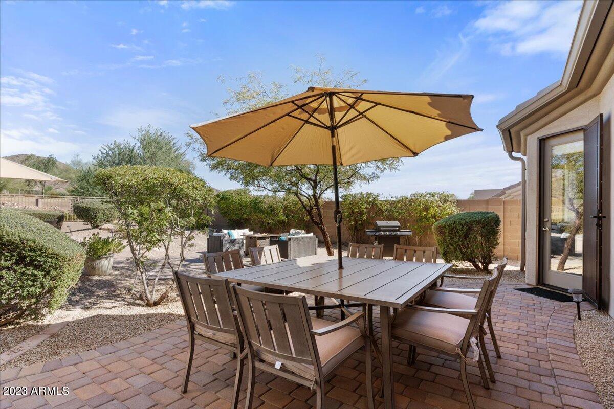 14257 North 106th Place Scottsdale, AZ 85255 - Photo 46 of 58 a view of an outdoor space with furniture and umbrella