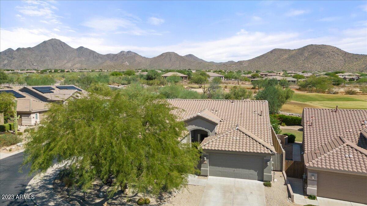 14257 North 106th Place Scottsdale, AZ 85255 - Photo 5 of 58 a view of a house with a mountain in the background