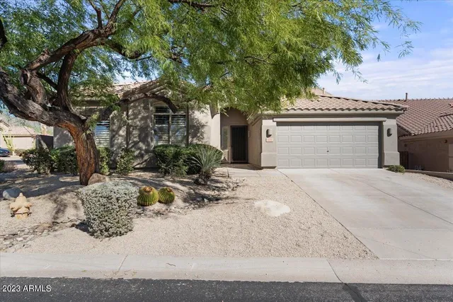 a living room with furniture a mirror and a clock