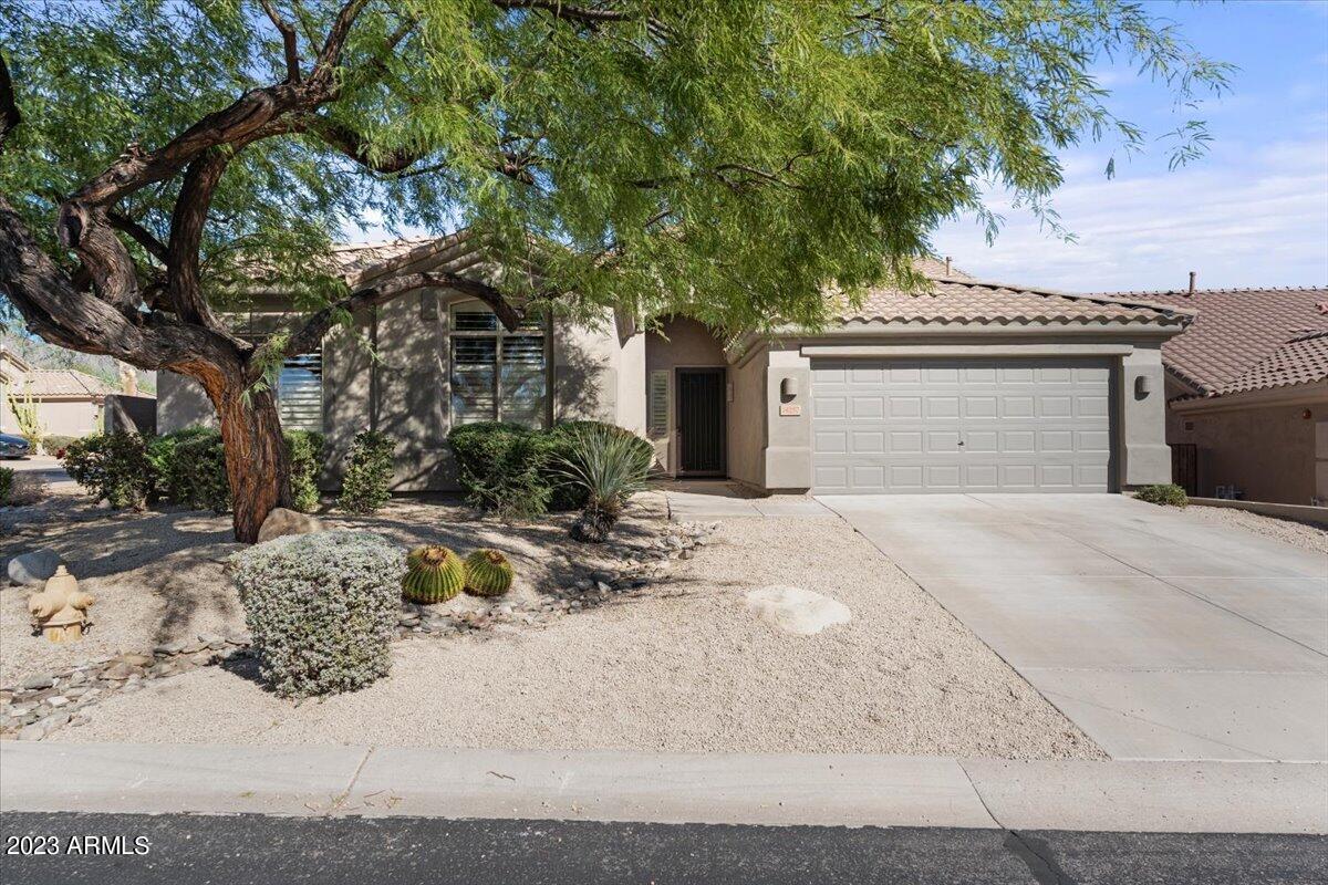 14257 North 106th Place Scottsdale, AZ 85255 - Photo 6 of 58 a view of a house with a yard