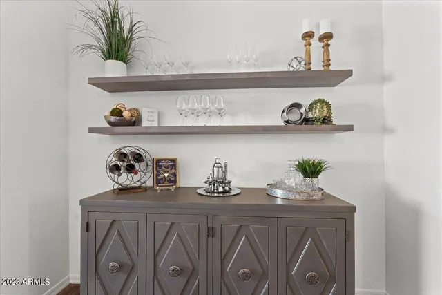 a view of a dining room with furniture and a chandelier