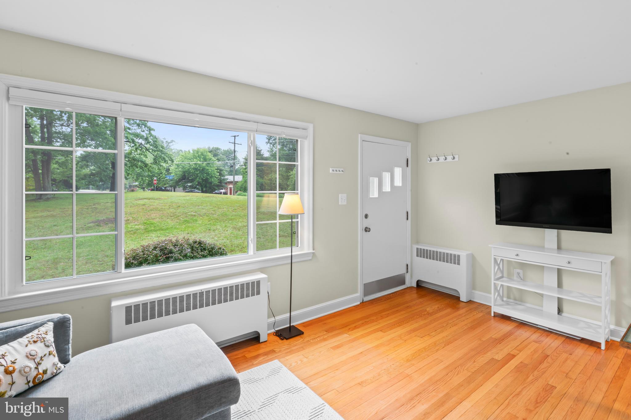 12131 Waples Mill Road Oakton, VA 22124 - Photo 5 of 40 a bedroom with a bed and a flat screen tv