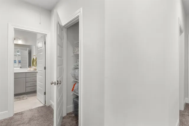 a bathroom with a sink double vanity granite tub and a mirror
