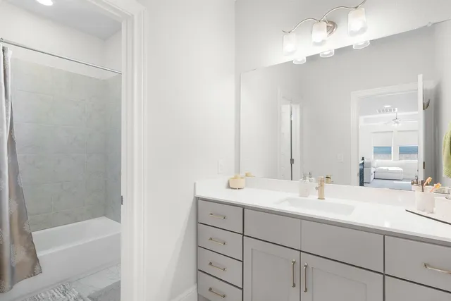 a view of livingroom with furniture fan and window