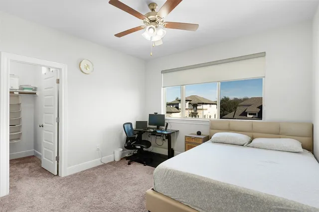 a view of a backyard with wooden fence