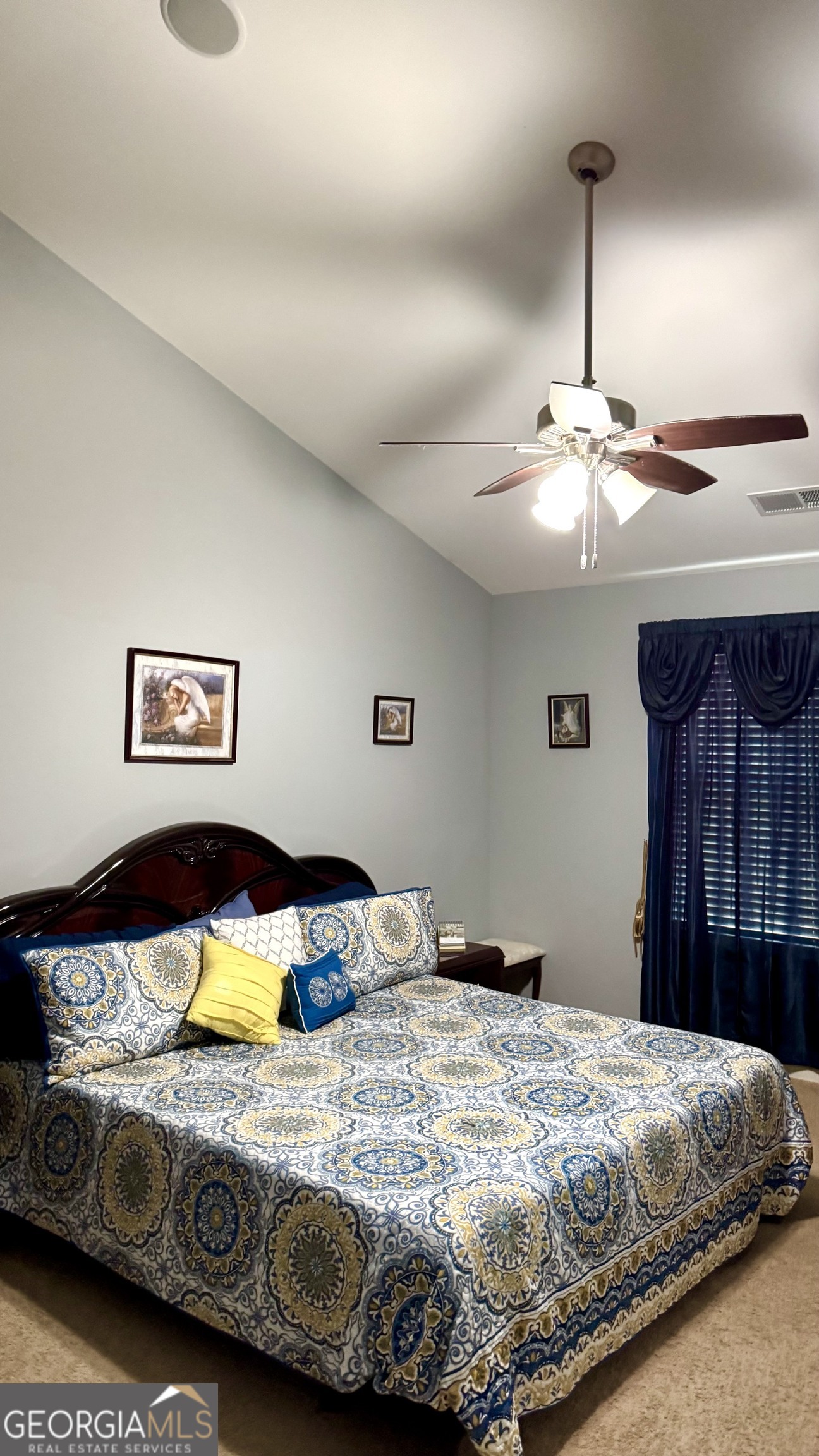 217 Happy Trail Locust Grove, GA 30248 - Photo 13 of 17 Primary bedroom with vaulted ceiling
