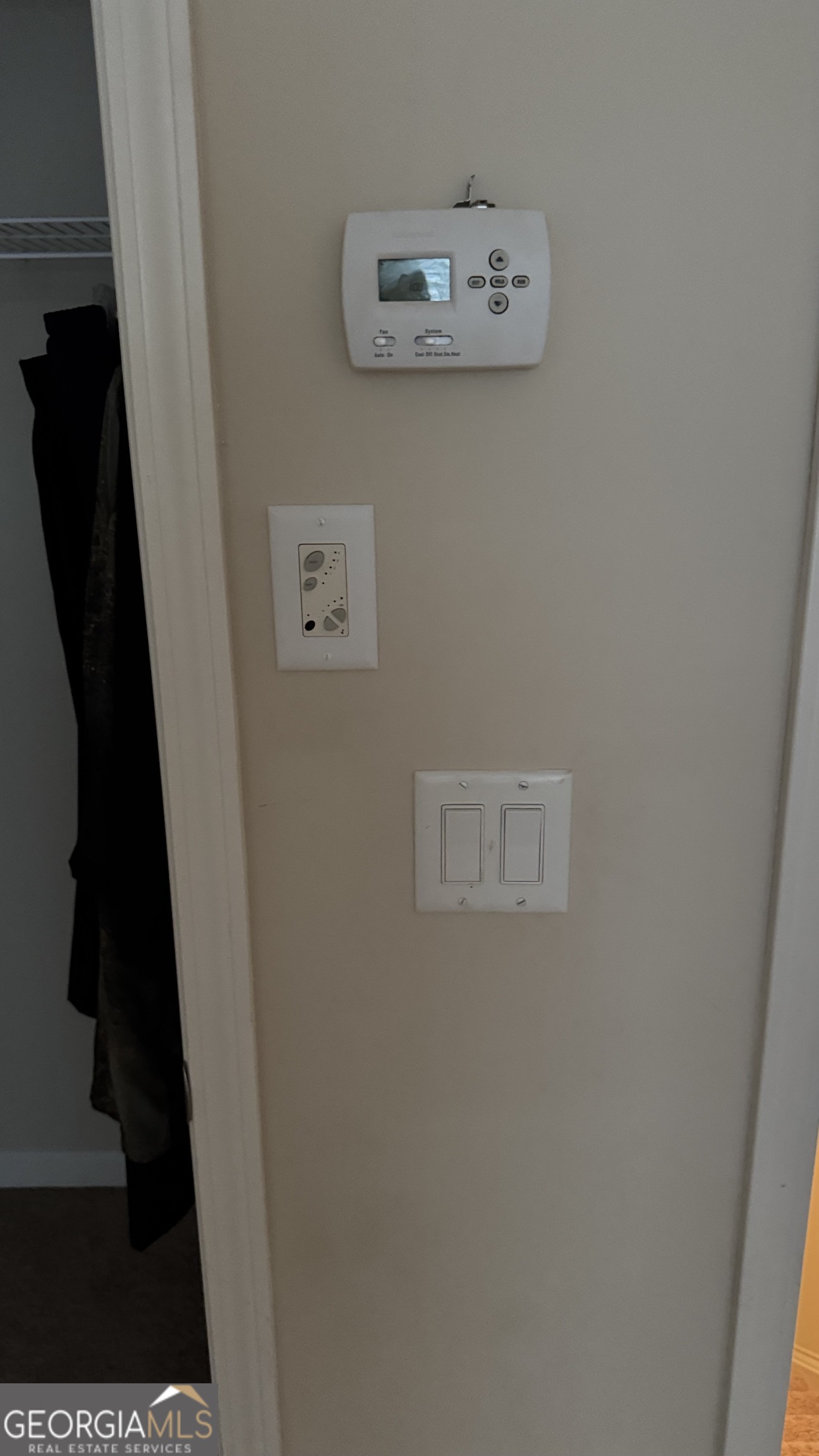 217 Happy Trail Locust Grove, GA 30248 - Photo 8 of 17 Zoned air thermostat in upstairs 4th bedroom