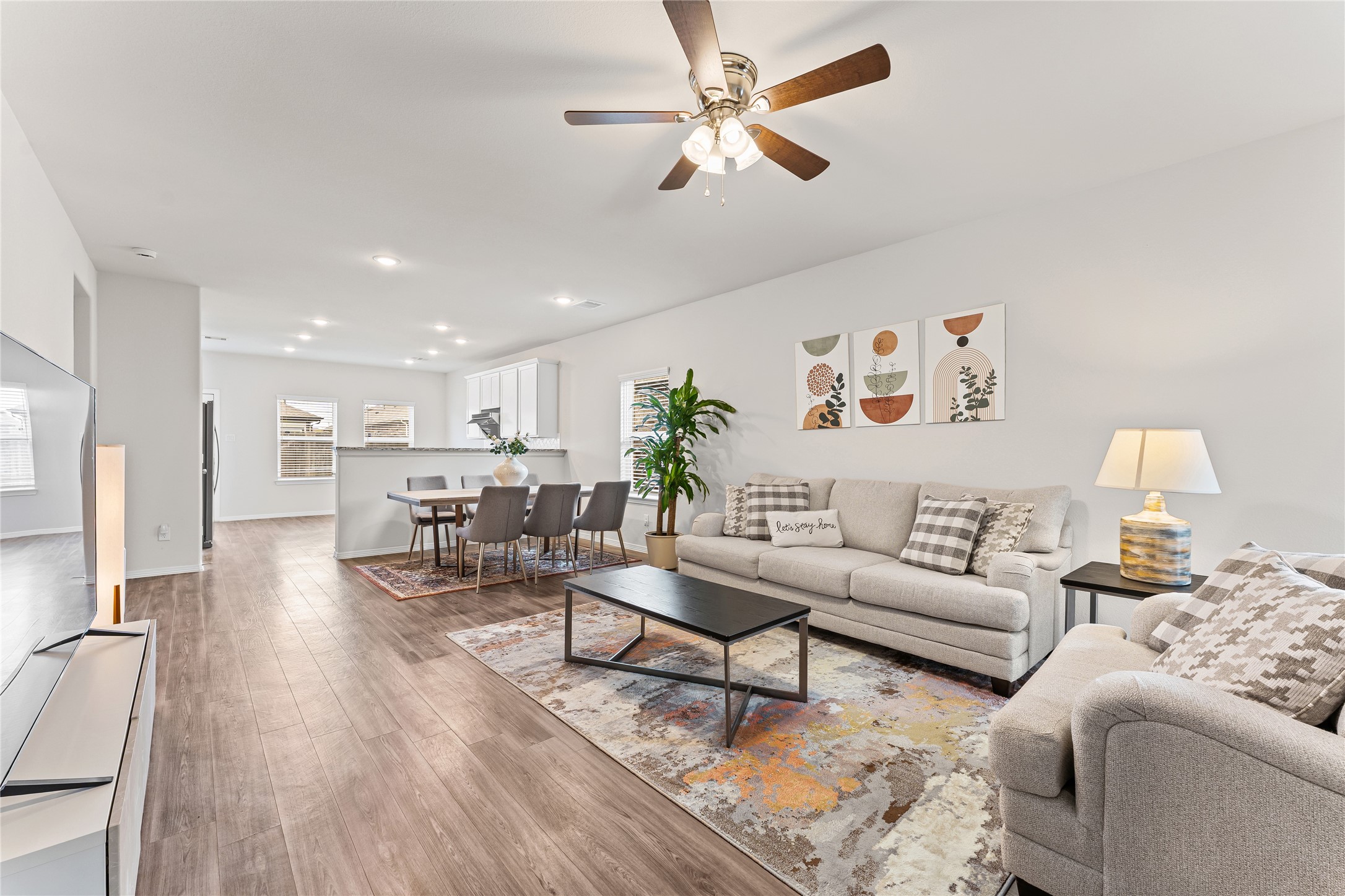 23326 Spring Genesis Lane Katy, TX 77493 - Photo 6 of 32 a living room with furniture and kitchen view