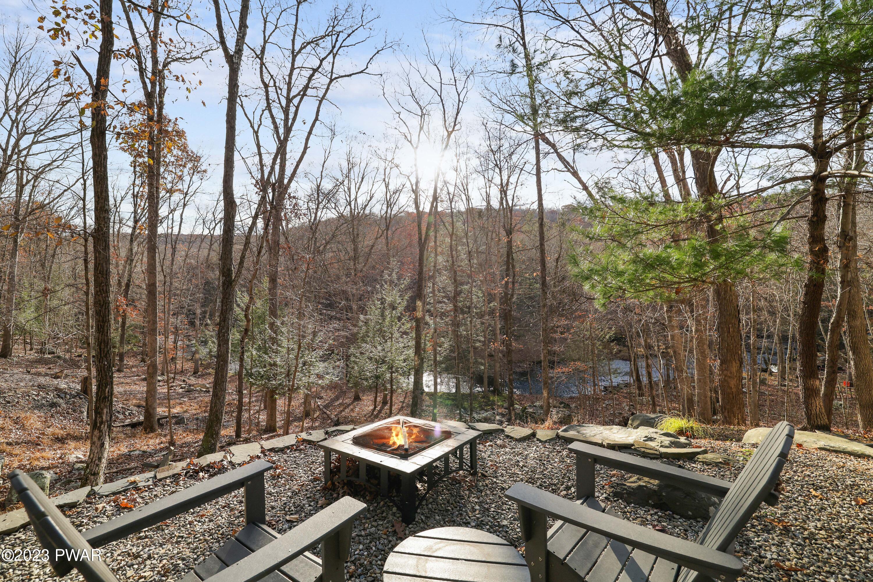 6348 Decker Road Bushkill, PA 18324 - Photo 30 of 36 a view of a patio with chairs and a table