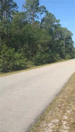a view of a yard with an ocean