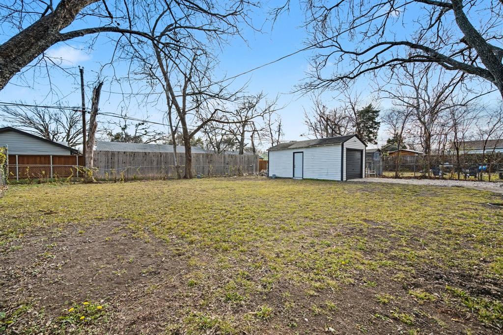 11446 Lippitt Avenue Dallas, TX 75218 - Photo 25 of 26 a house view with swimming pool in front of it