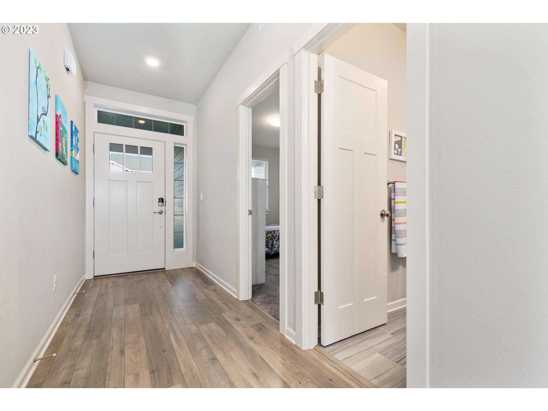 3915 South 40th Place Ridgefield, WA 98642 - Photo 3 of 33 a view of a hallway with wooden floor