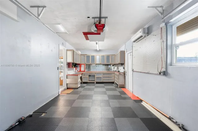 a bathroom with a sink and a large window