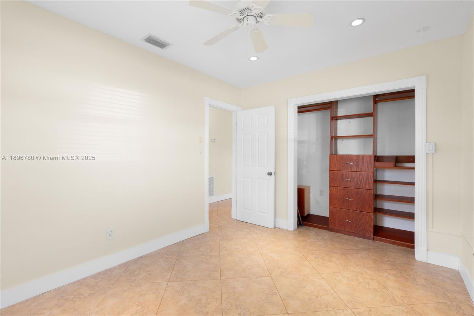 7305 Northwest 95th Way Tamarac, FL 33321 - Photo 22 of 24 a view of room with closet and cabinet