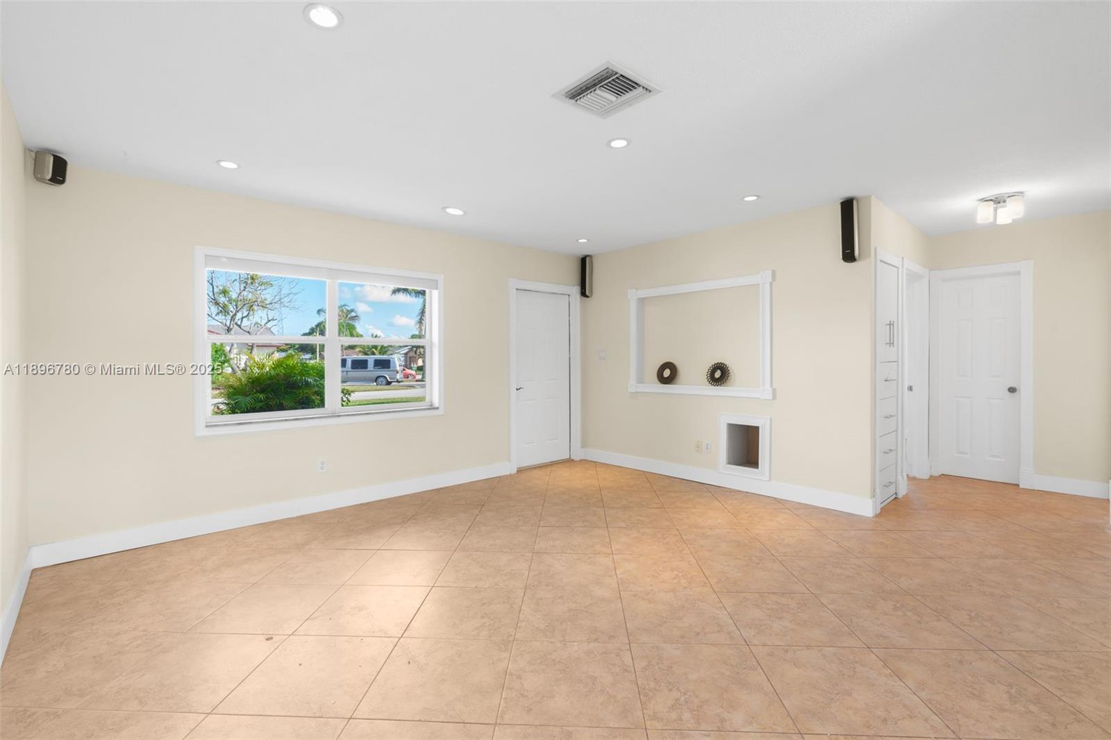 7305 Northwest 95th Way Tamarac, FL 33321 - Photo 4 of 24 a view of an empty room with a window