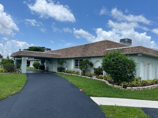 7305 Northwest 95th Way Tamarac, FL 33321 - Photo 6 of 24 a view of a yard in front of house