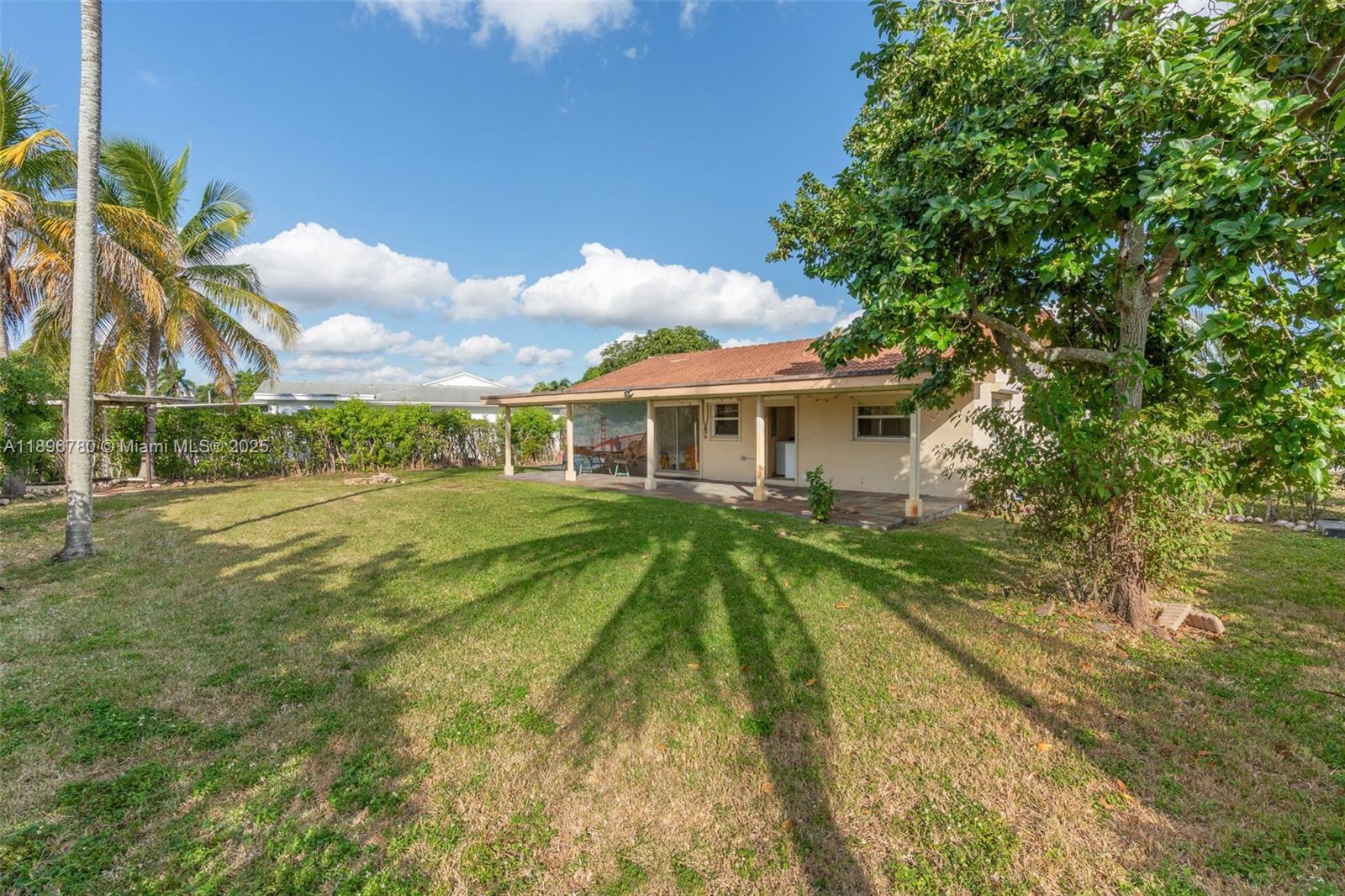 7305 Northwest 95th Way Tamarac, FL 33321 - Photo 7 of 24 a view of house with a yard
