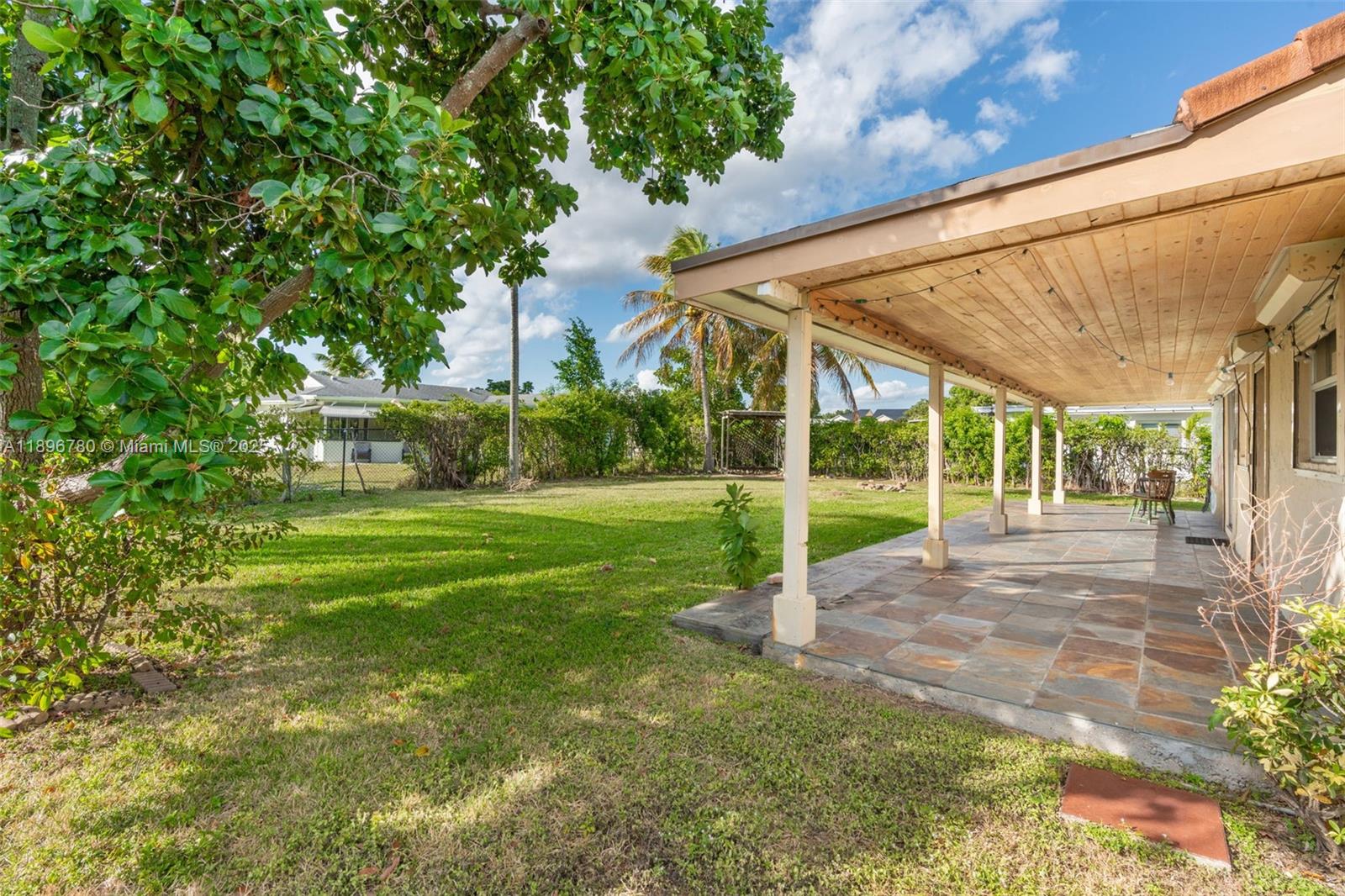 7305 Northwest 95th Way Tamarac, FL 33321 - Photo 8 of 24 a view of a house with a big yard