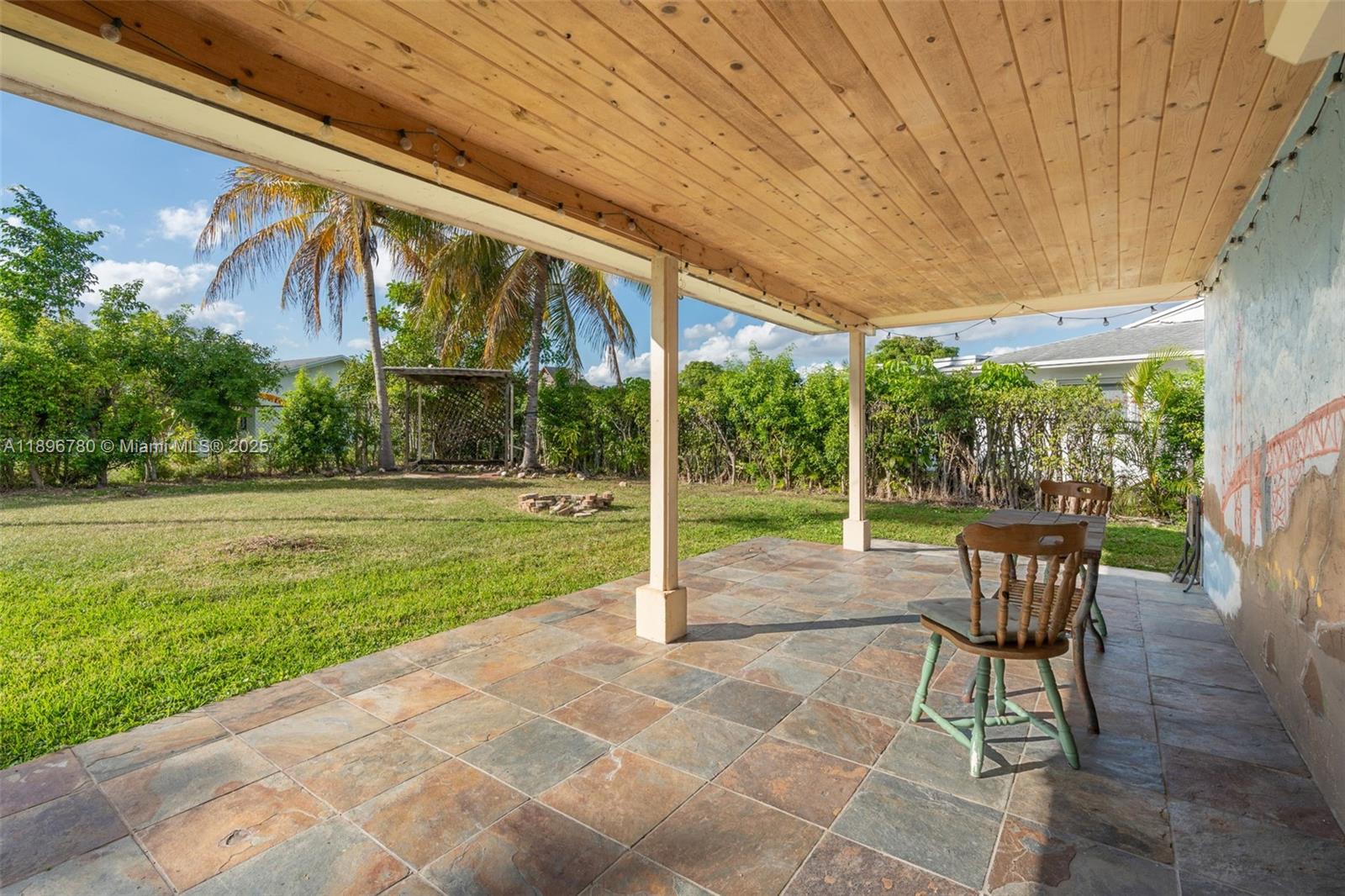 7305 Northwest 95th Way Tamarac, FL 33321 - Photo 10 of 24 a view of a porch with chairs and backyard