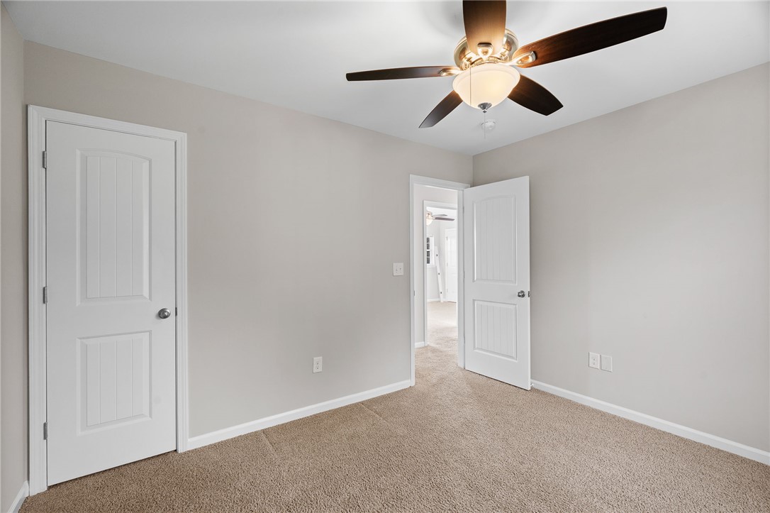 119 Sunny Point Loop Central, SC 29630 - Photo 29 of 33 Smooth carpeting pairs with clean neutral walls under a classic white ceiling.