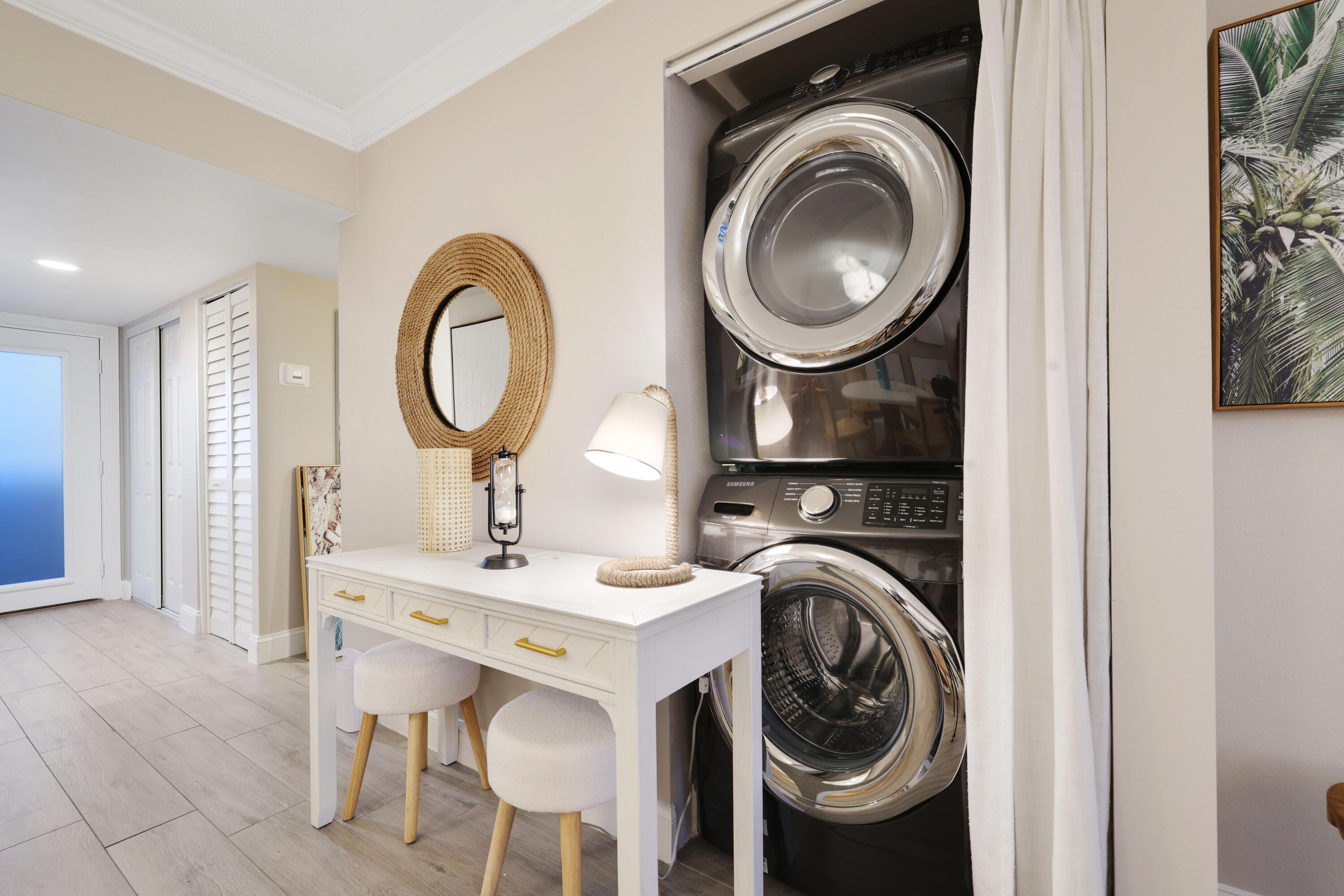 601 North Ocean Boulevard Boca Raton, FL 33432 - Photo 13 of 36 a kitchen with a sink and a washer dryer