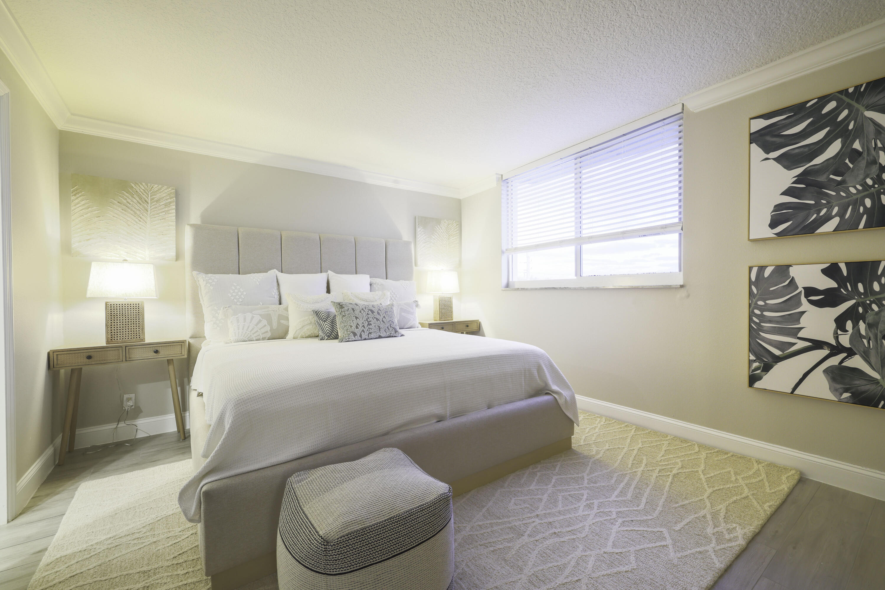 601 North Ocean Boulevard Boca Raton, FL 33432 - Photo 17 of 36 a bedroom with a bed and a couch