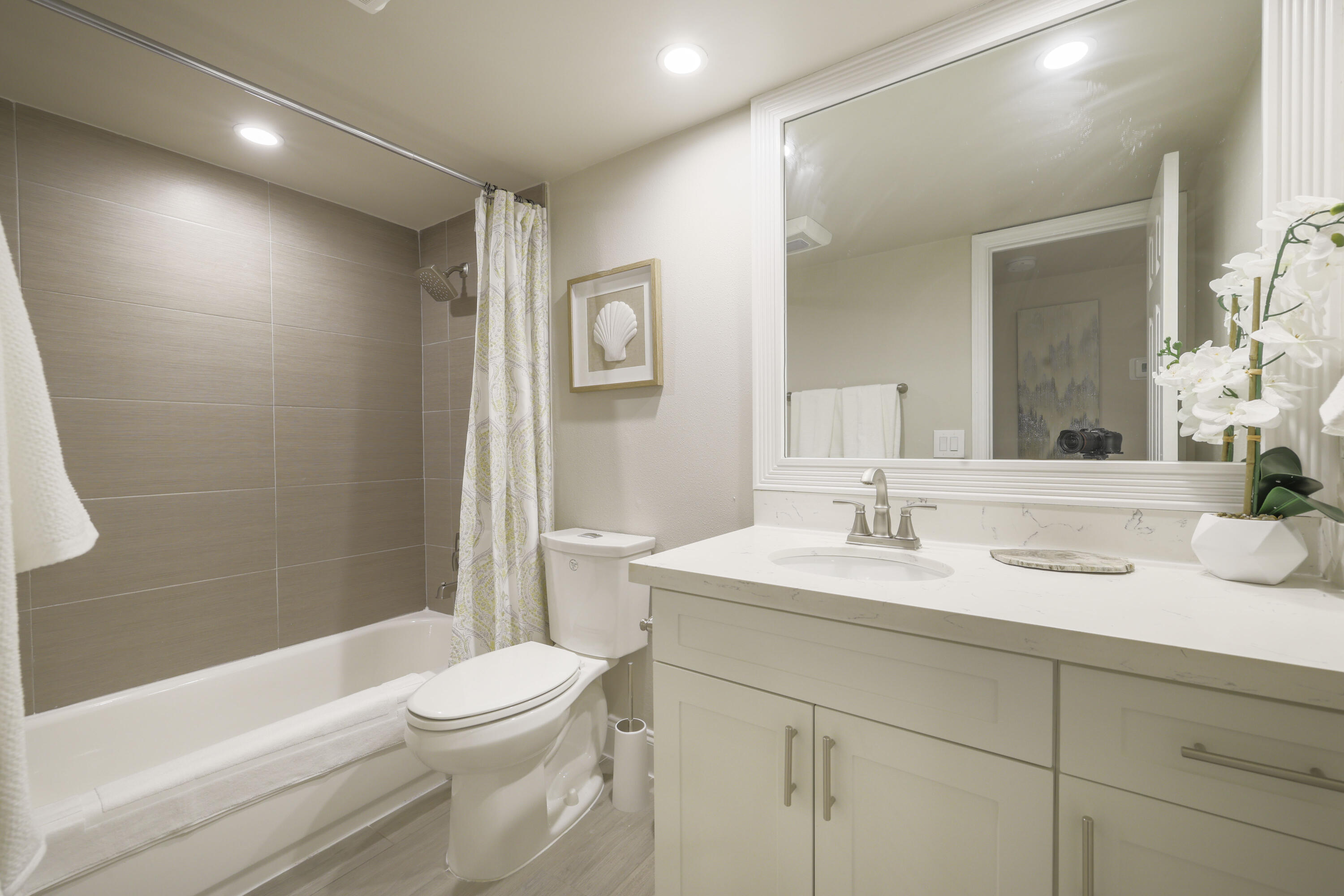 601 North Ocean Boulevard Boca Raton, FL 33432 - Photo 22 of 36 a bathroom with a sink a toilet and shower