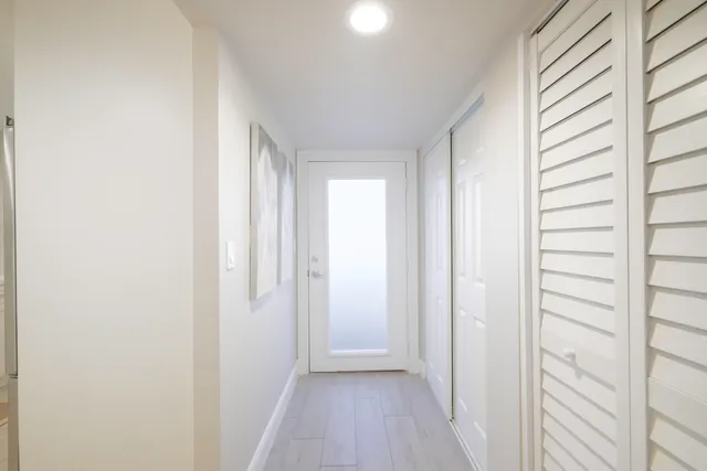 a view of a chairs and table in a balcony