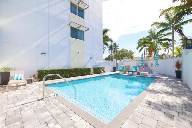a view of a patio with a dining table and chairs