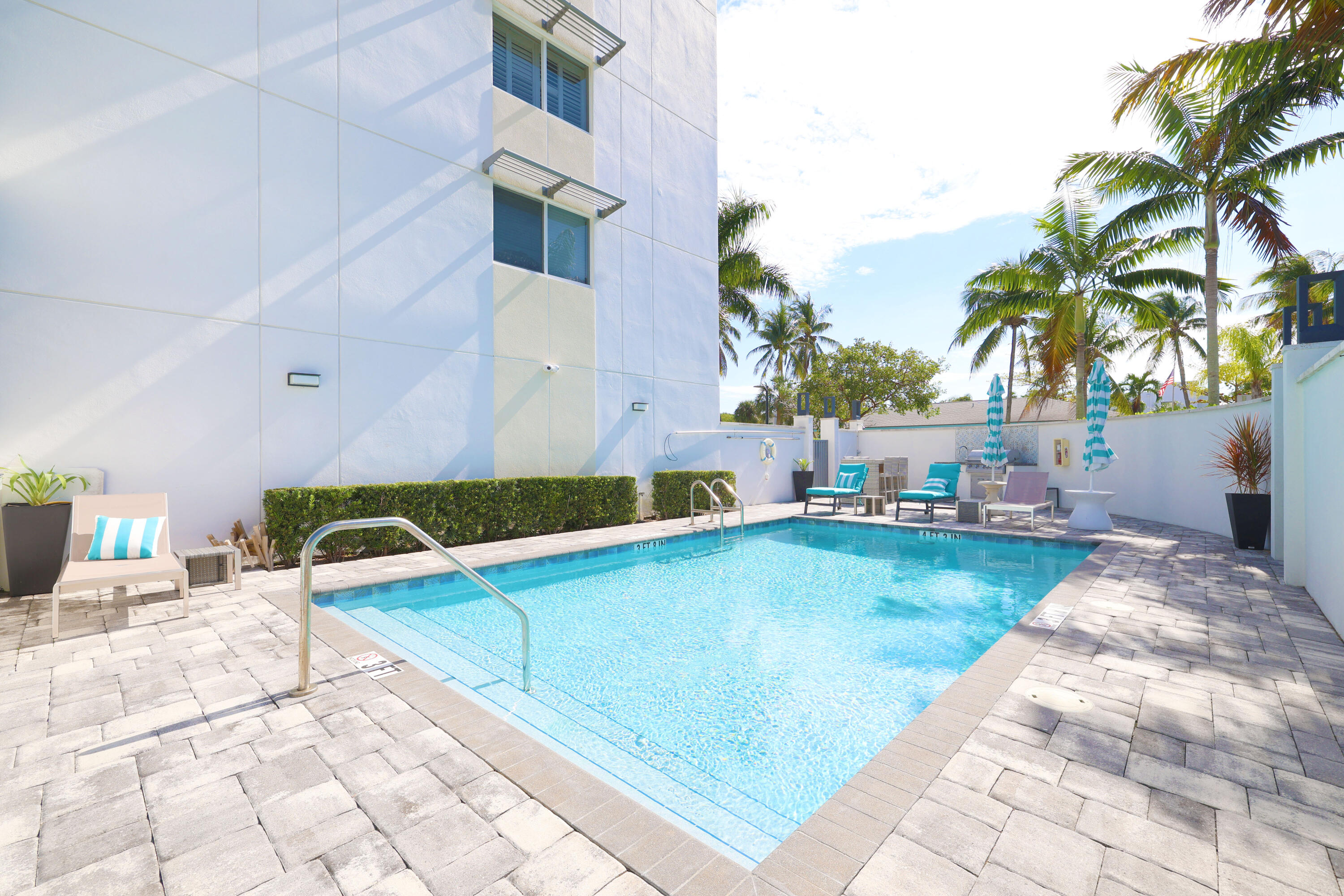 601 North Ocean Boulevard Boca Raton, FL 33432 - Photo 29 of 36 a view of swimming pool with outdoor seating and plants