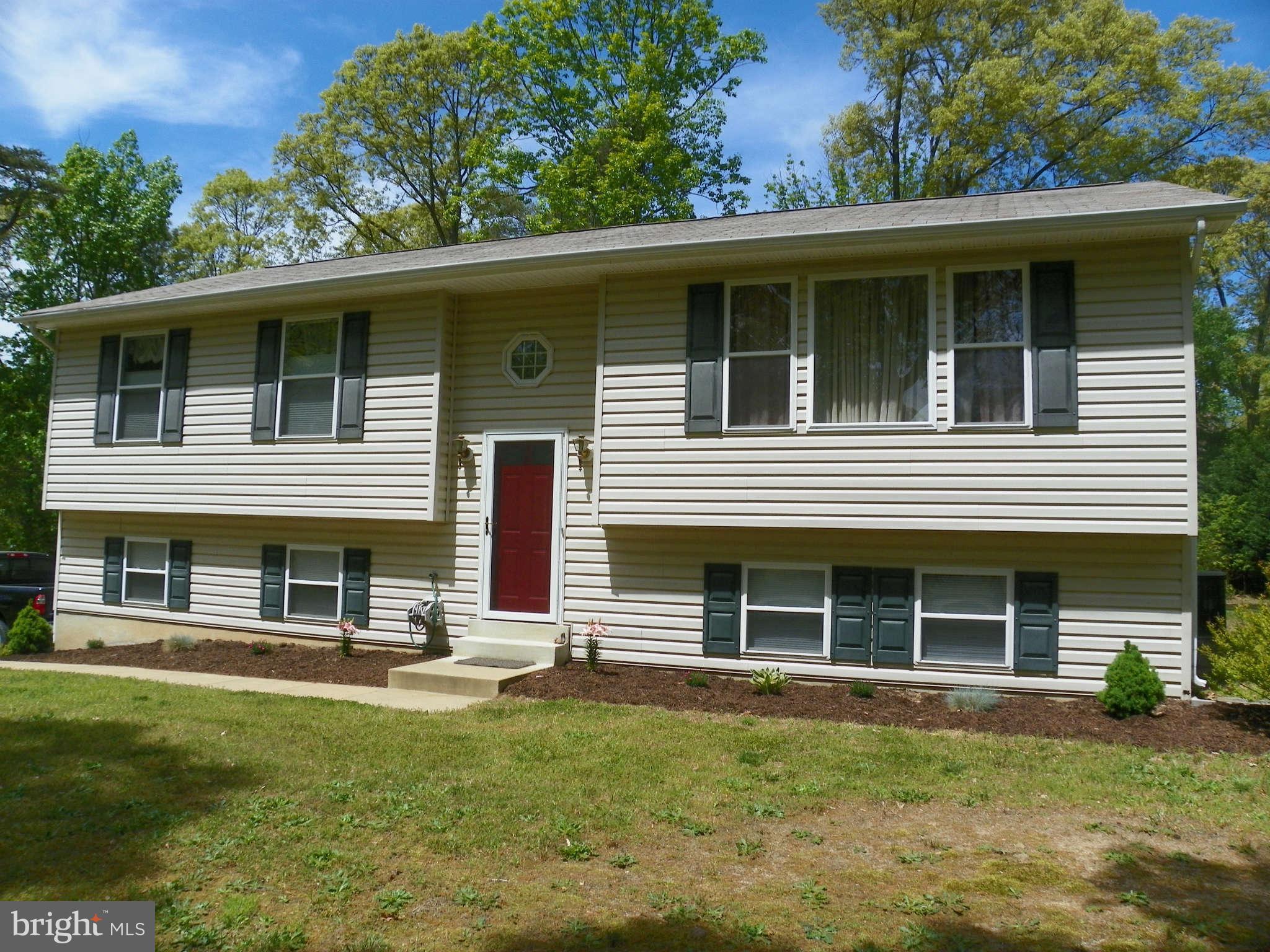 1130 Calvert Beach Road St. Leonard, MD 20685 - Photo 1 of 21 front view of a house with a yard