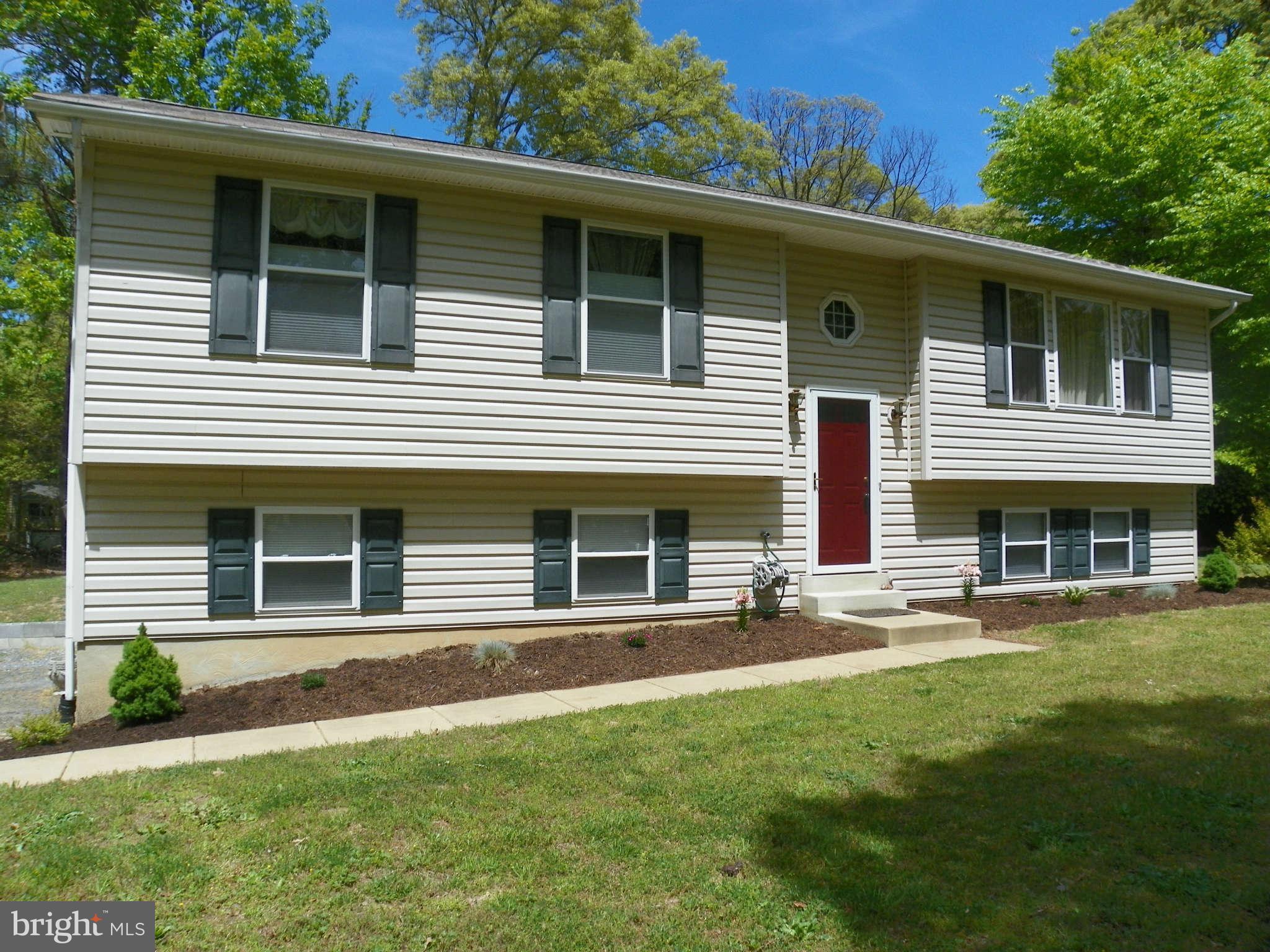 1130 Calvert Beach Road St. Leonard, MD 20685 - Photo 2 of 21 a front view of a house with a yard
