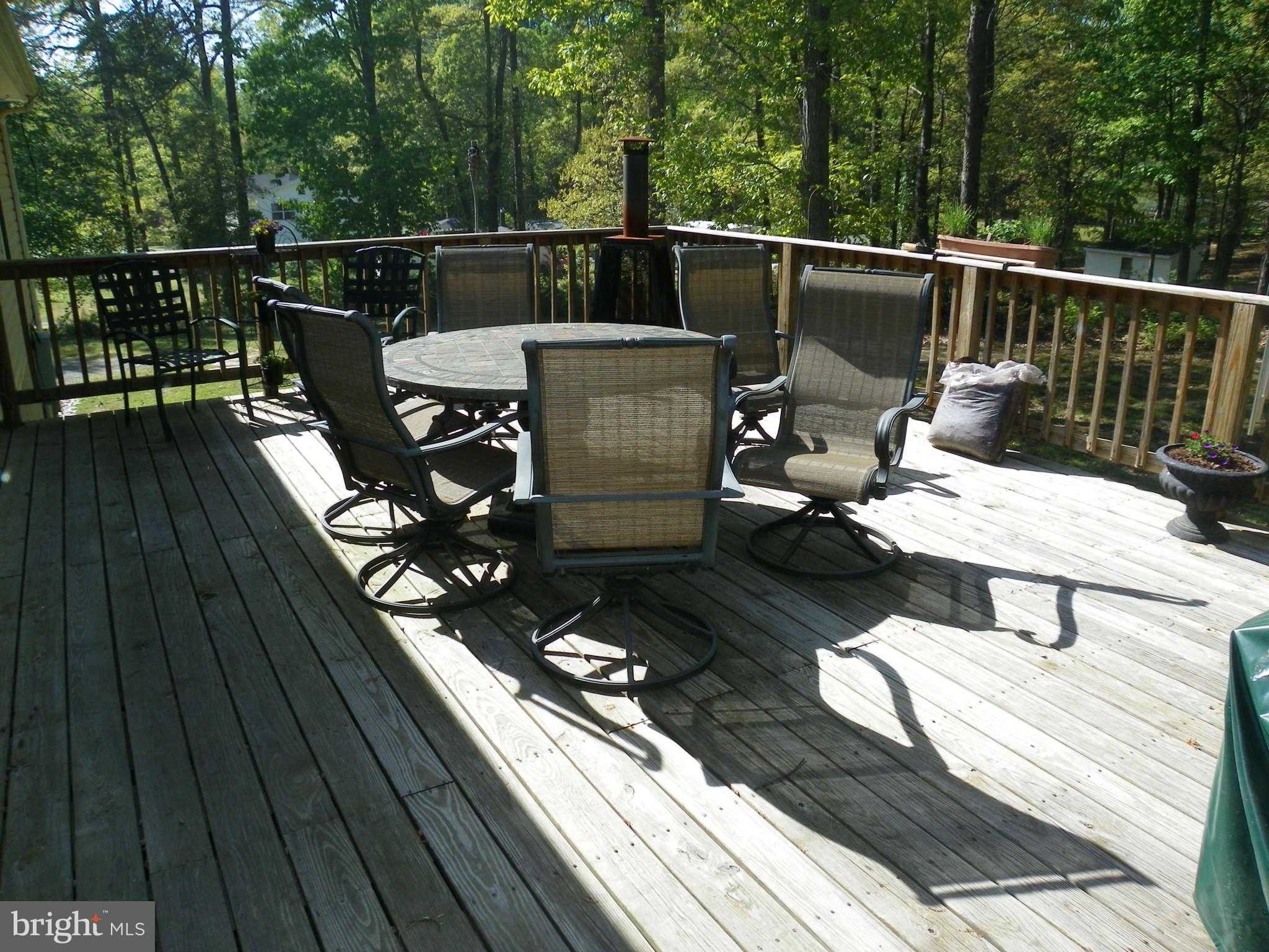 1130 Calvert Beach Road St. Leonard, MD 20685 - Photo 17 of 21 a view of a roof deck with couches