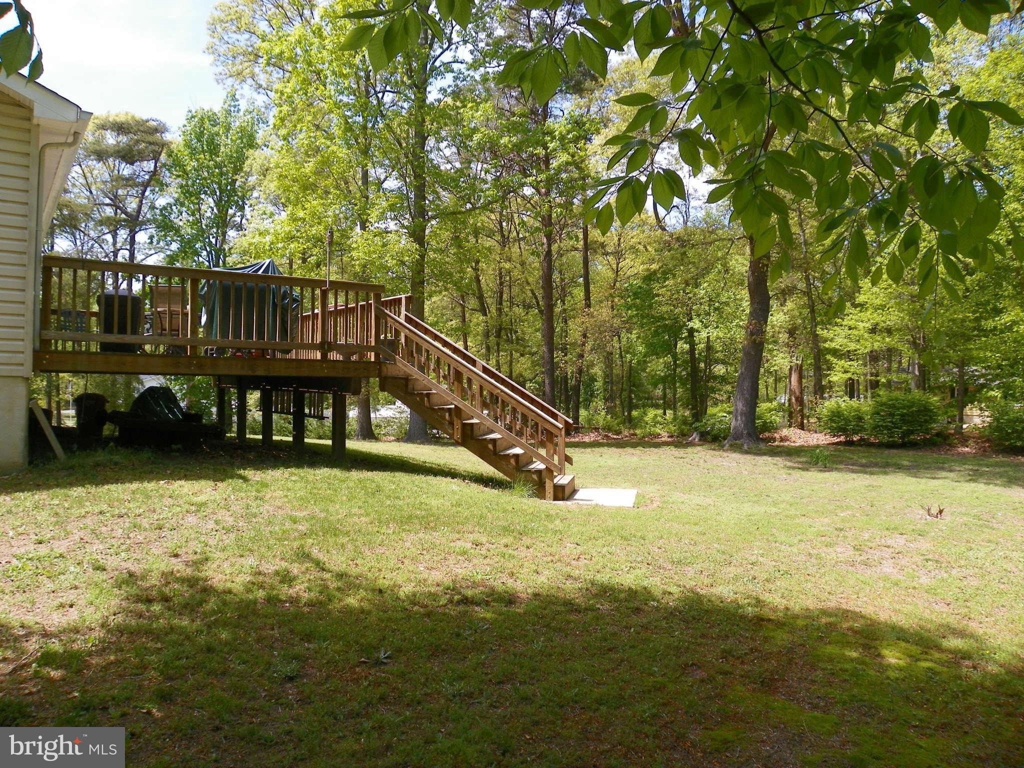 1130 Calvert Beach Road St. Leonard, MD 20685 - Photo 4 of 21 a view of swimming pool with deck and a yard