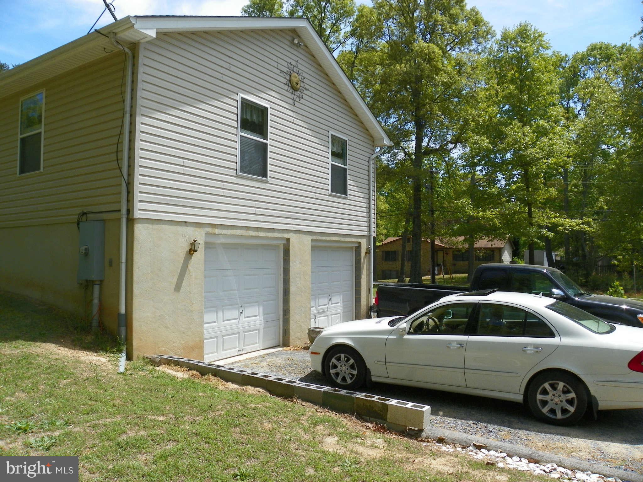 1130 Calvert Beach Road St. Leonard, MD 20685 - Photo 6 of 21 a view of a car parked in front of a house