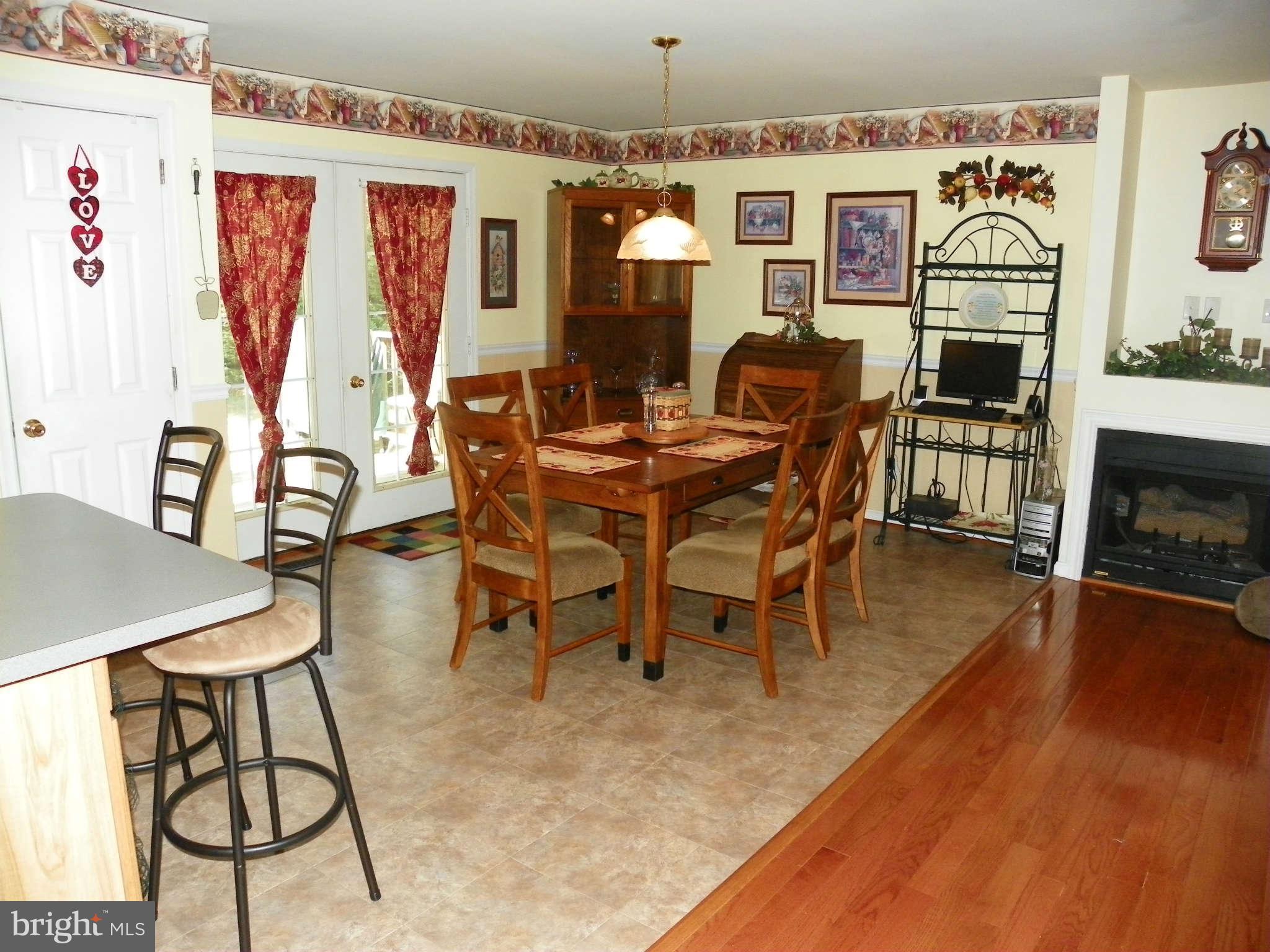 1130 Calvert Beach Road St. Leonard, MD 20685 - Photo 9 of 21 a dining room with furniture window and wooden floor