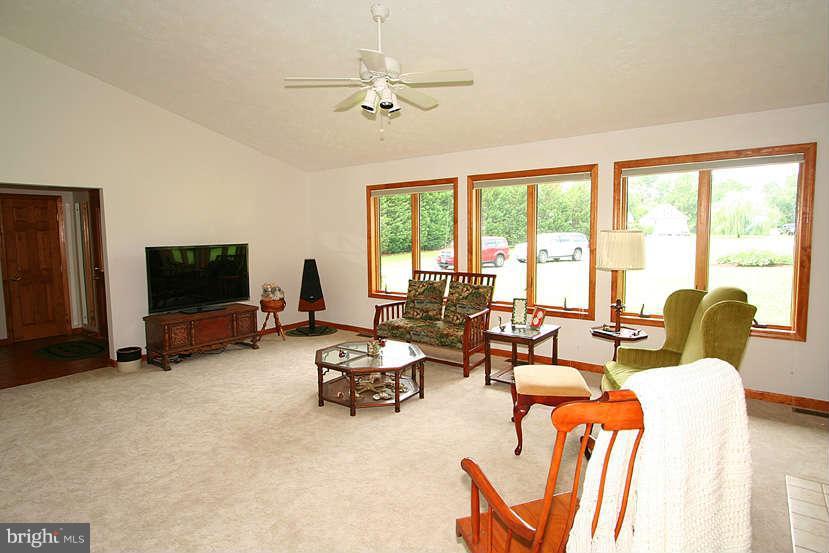 605 Old Point Road Chester, MD 21619 - Photo 11 of 30 a living room with furniture and a flat screen tv