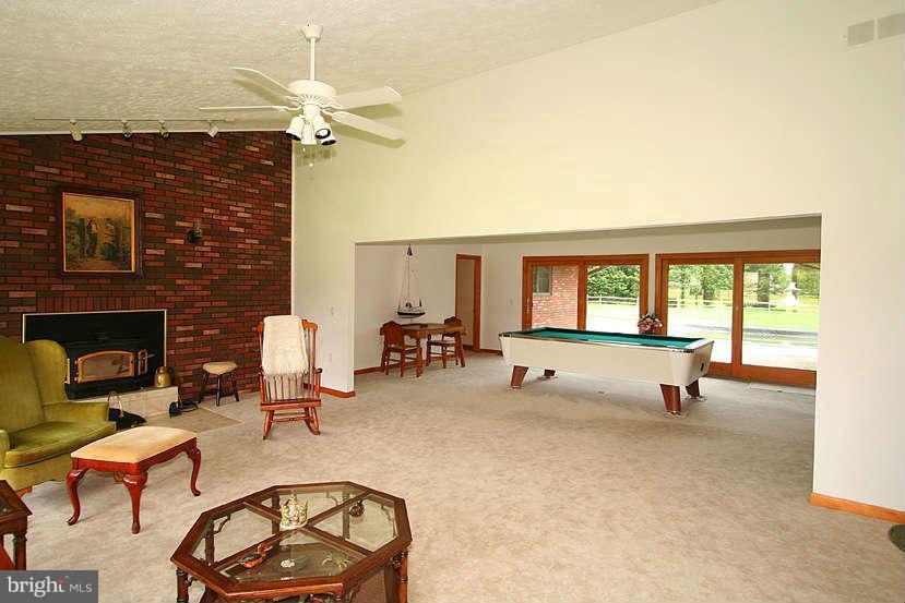 605 Old Point Road Chester, MD 21619 - Photo 12 of 30 a living room with furniture and a fireplace