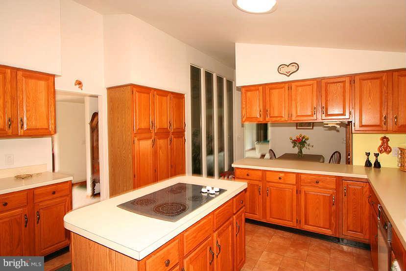 605 Old Point Road Chester, MD 21619 - Photo 20 of 30 a kitchen that has a sink a stove and a wooden floor