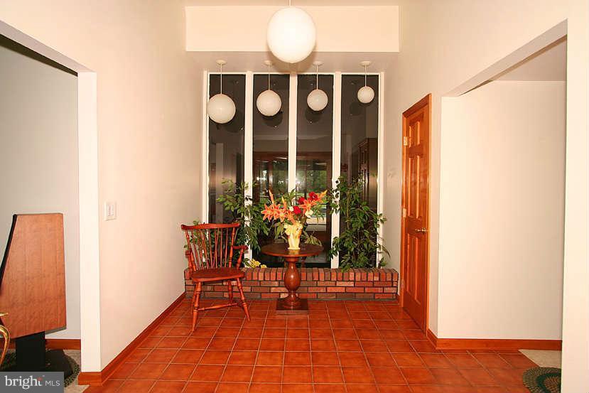 605 Old Point Road Chester, MD 21619 - Photo 22 of 30 a view of a porch with a table and chairs