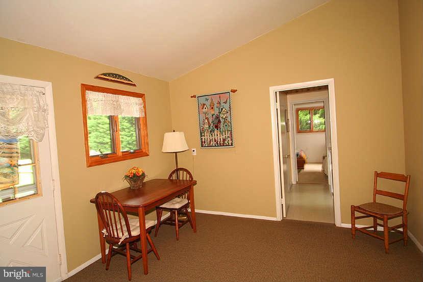 605 Old Point Road Chester, MD 21619 - Photo 23 of 30 a view of a workspace with furniture and a window