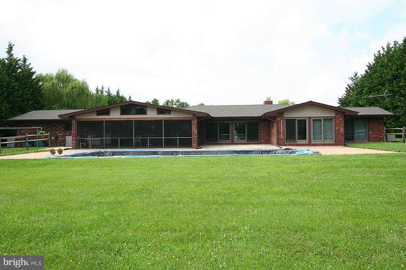 605 Old Point Road Chester, MD 21619 - Photo 6 of 30 a front view of house with a garden