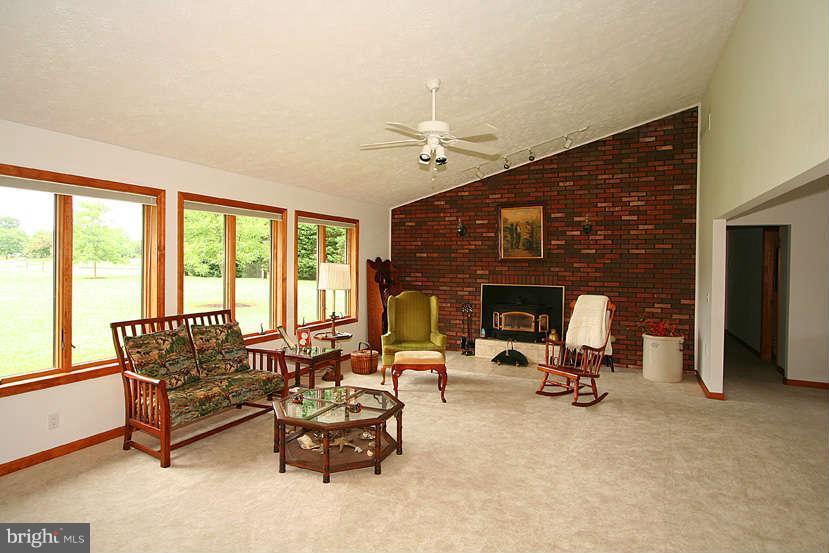 605 Old Point Road Chester, MD 21619 - Photo 10 of 30 a living room with furniture and a fireplace