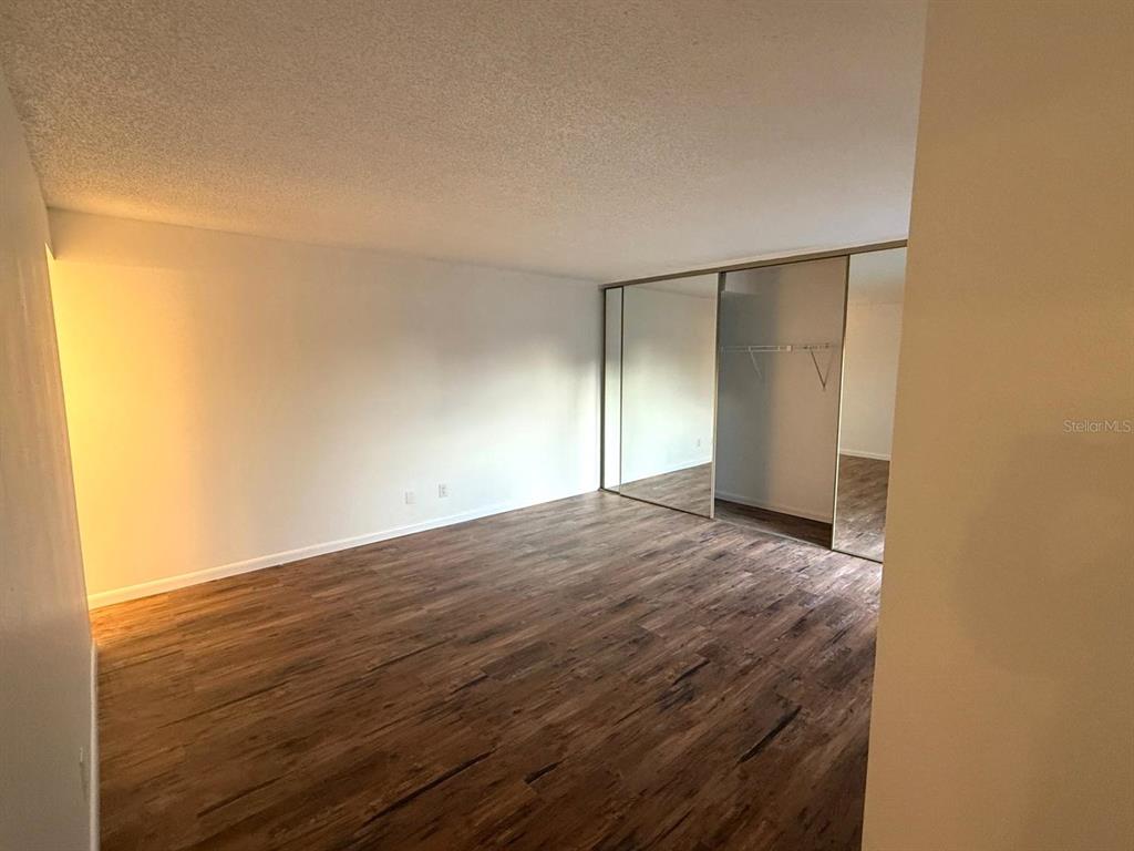 1406 Park Shore Circle, Unit 3 Fort Myers, FL 33901 - Photo 11 of 25 a view of empty room with wooden floor