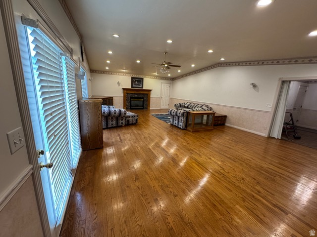 588 North 4500 West West Point, UT 84015 - Photo 7 of 61 Living room with a glass covered fireplace, hardwood floors, recessed lighting, and a ceiling fan