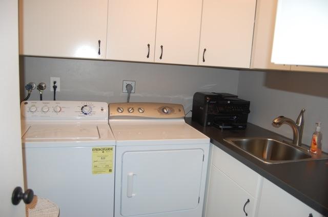 2899 Northwest 24th Court Boca Raton, FL 33431 - Photo 12 of 31 a utility room with dryer and washer