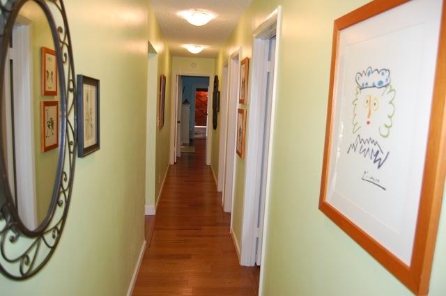 2899 Northwest 24th Court Boca Raton, FL 33431 - Photo 13 of 31 a view of a hallway with wooden floor and door