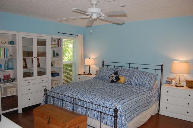 2899 Northwest 24th Court Boca Raton, FL 33431 - Photo 14 of 31 a bedroom with a bed and wooden floor