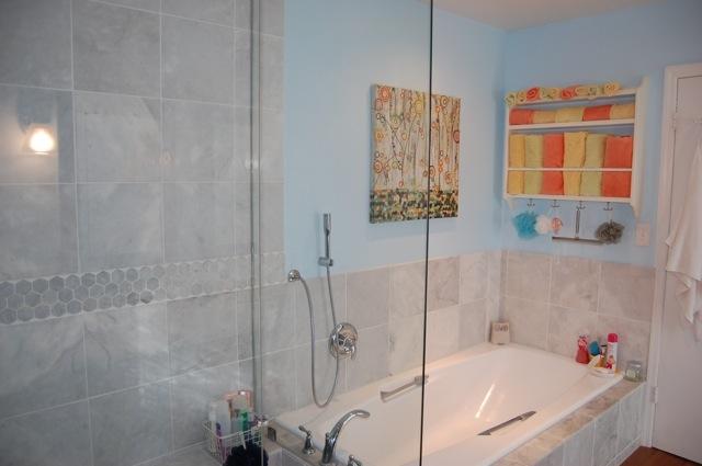 2899 Northwest 24th Court Boca Raton, FL 33431 - Photo 16 of 31 a bathroom with a tub and shower